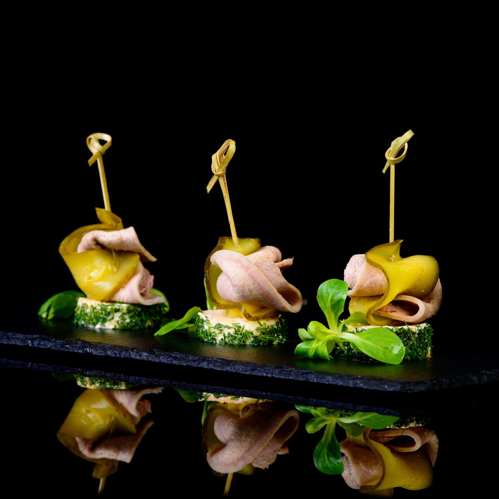 Canapes,With,Neat's,Tongue,And,Pickled,Cucumber,On,Black,Background